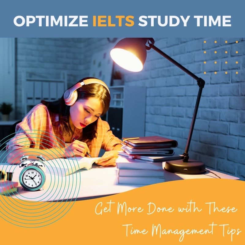 IELTS Time Management: Productive female student studying at night with desk lamp, surrounded by books and looking closely at a dictionary. Focus on time management with an alarm clock on the desk. Get more done with these time management tips. Image for English Enrichment Club blog post